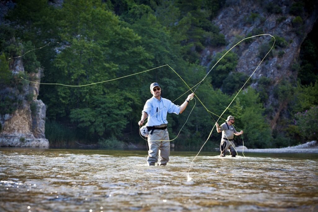 Angler demonstrating fly fishing casting technique