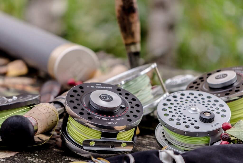 Essential fly fishing gear including rod, reel, and flies
